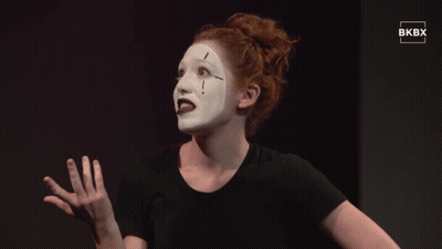Woman In Black Shirt With White Face Paint GIF