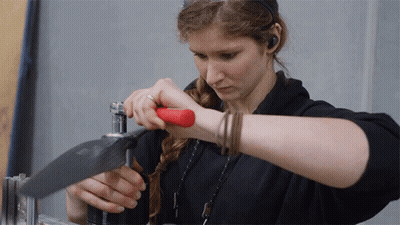 Woman In Black Shirt Working Metal GIF