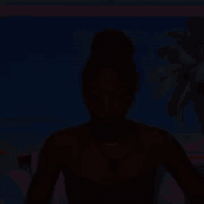 Woman In Black Strapless Top And Necklace At Beach GIF