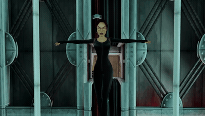 Woman In Black Suit And Glasses With Arms Outstretched In Elevator GIF