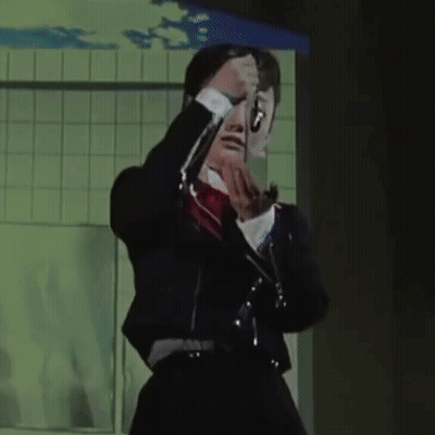 Woman In Black Suit And Red Bow Tie GIF