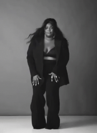 Woman In Black Suit Black And White Photo GIF