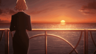 Woman In Black Suit Overlooking Ocean Sunset GIF