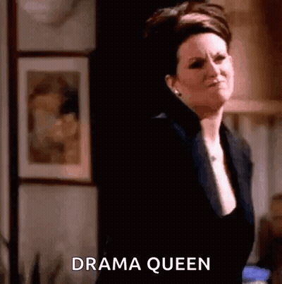 Woman In Black Suit Saying Drama Queen GIF