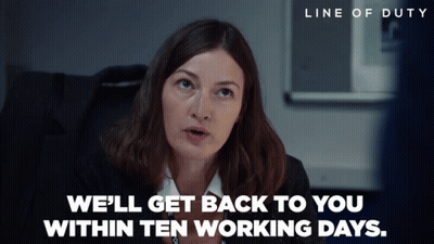 Woman In Black Suit Says We'll Get Back To You Within Ten Working Days GIF