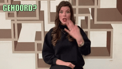Woman In Black Sweater Gesturing With Gehoord GIF