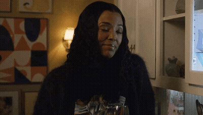 Woman In Black Sweater Holding Glass Of Water GIF