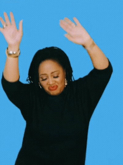 Woman In Black Sweater Raising Hands GIF