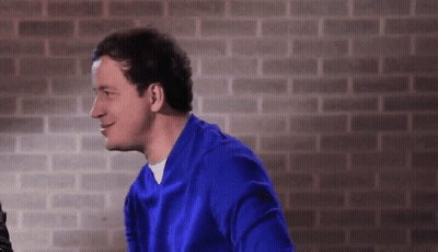 Woman In Black Sweater Sitting On Chair GIF