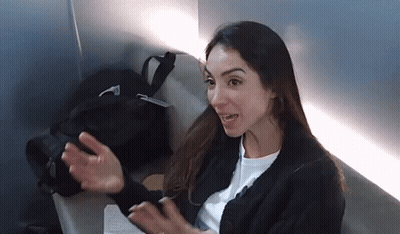 Woman In Black Sweater Sitting On Chair GIF