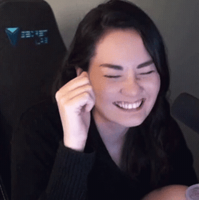 Woman In Black Sweater Smiling With Eyes Closed GIF
