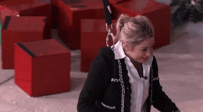 Woman In Black Sweater With Chanel GIF