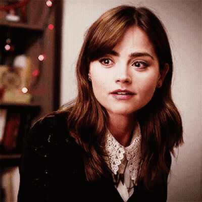 Woman In Black Sweater With White Lace Collar GIF
