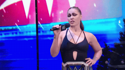Woman In Black Swimsuit Holding Microphone GIF
