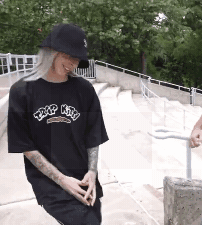 Woman In Black T-Shirt And Hat On Skateboard Ramp GIF