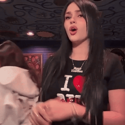 Woman In Black T-Shirt Saying I Love Emirates GIF