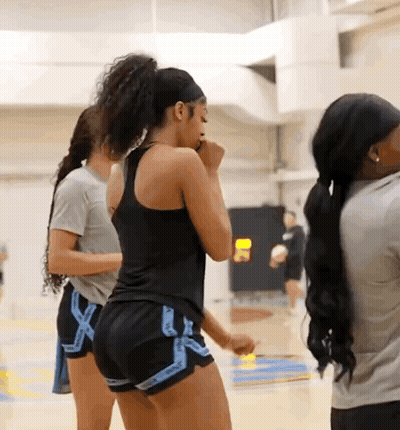 Woman In Black Tank Top And Blue Shorts With X GIF