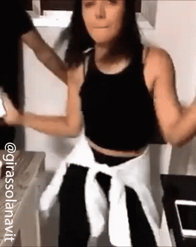 Woman In Black Tank Top Dancing With Man GIF