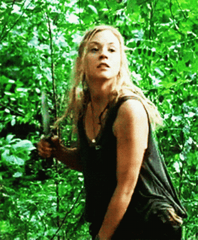 Woman In Black Tank Top Holding Knife GIF