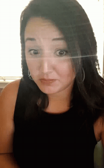 Woman In Black Tank Top Looks Surprised GIF