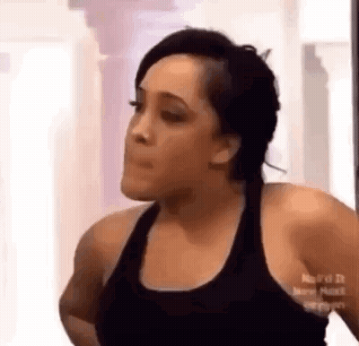 Woman In Black Tank Top Making Funny Face GIF