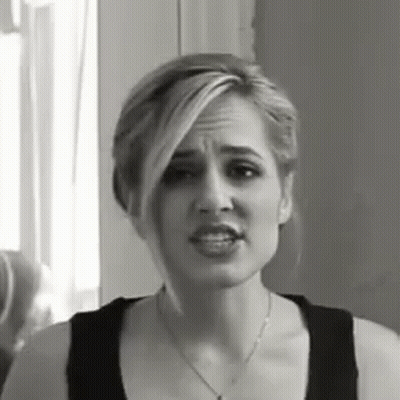 Woman In Black Tank Top Necklace Funny Face GIF
