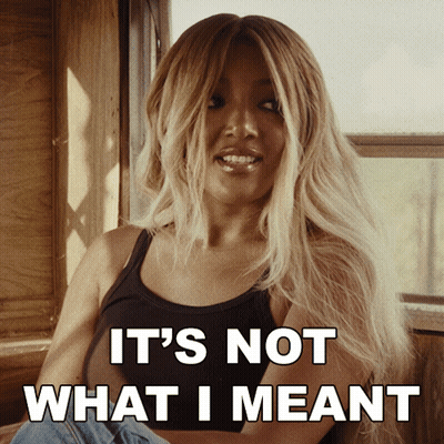 Woman In Black Tank Top Saying Not What I Meant GIF