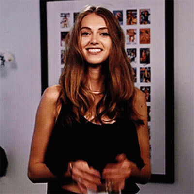 Woman In Black Tank Top Smiling With Wine GIF
