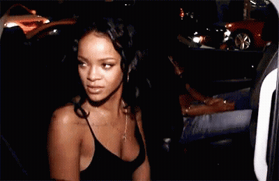 Woman In Black Tank Top Standing By Car At Night GIF
