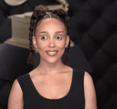 Woman In Black Tank Top With Braids GIF