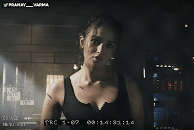 Woman In Black Tank Top With Pranay Varma On Screen GIF