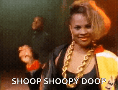 Woman In Black Top And Gold Chains Says Shoop Shoopy Doop GIF
