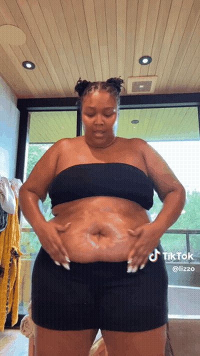 Woman In Black Top And Shorts In Bathroom GIF