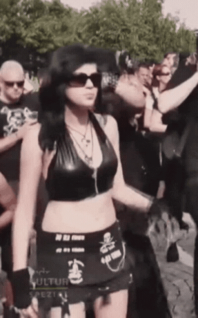 Woman In Black Top And Skirt With Kultur GIF
