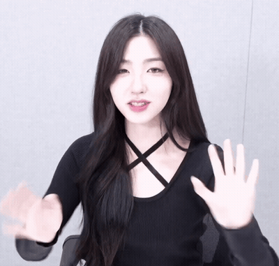 Woman in Black Top Waving