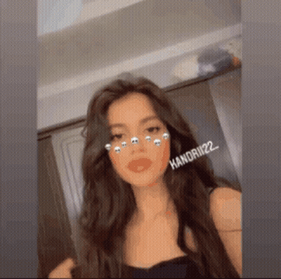 Woman In Black Top With Long Brown Hair And Filter GIF