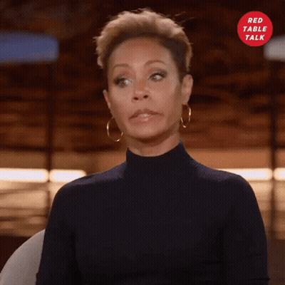 Woman In Black Turtleneck And Gold Hoop Earrings GIF