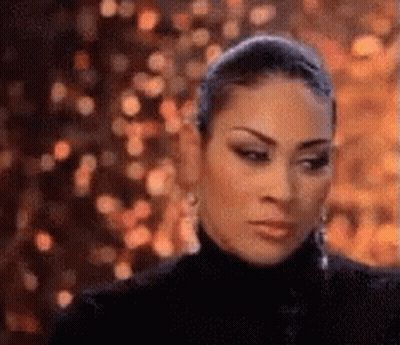Woman In Black Turtleneck Looking At Camera GIF