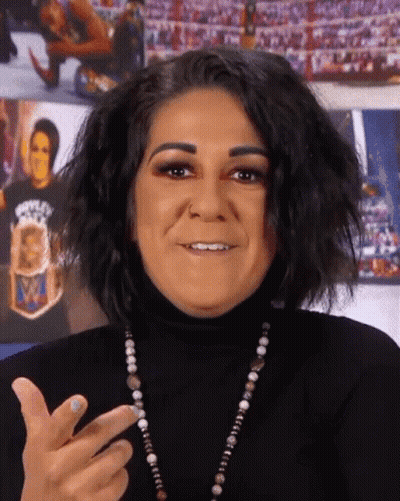 Woman In Black Turtleneck Smiling Making Funny Face GIF