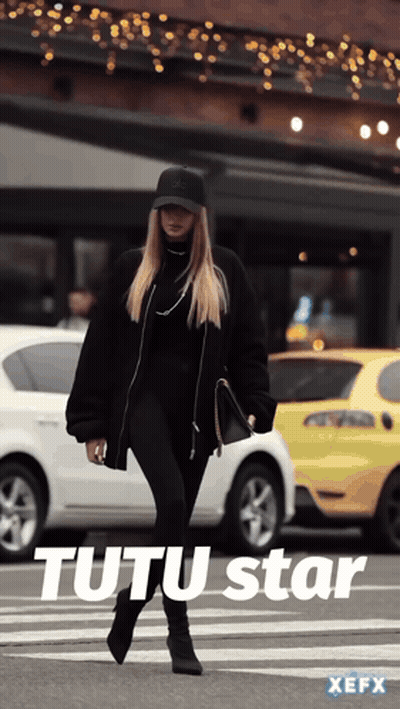 Woman In Black Walking With Tutu Star Text GIF