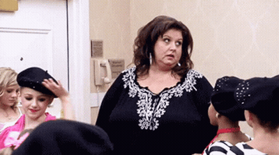 Woman In Black White Top With Girls In Berets GIF