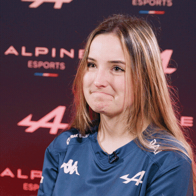 Woman In Blue Alpine Esports Shirt Making Face GIF