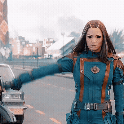 Woman In Blue And Brown Superhero Costume GIF