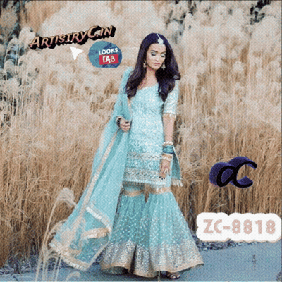 Woman In Blue And Gold Dress Artistry Gin FAQ GIF
