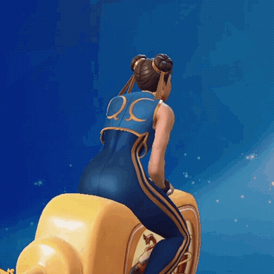 Woman In Blue And Gold Outfit Riding Yellow Object GIF