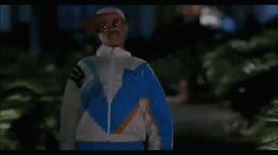 Woman In Blue And White Jacket Looking At Camera GIF