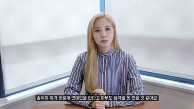 Woman In Blue And White Striped Shirt At Desk GIF