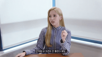 Woman In Blue And White Striped Shirt Sitting GIF