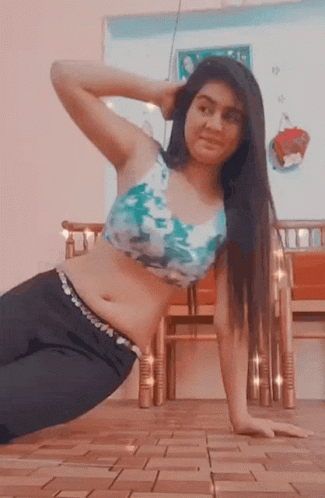 Woman in Blue and White Top Doing Push Ups