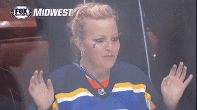 Woman In Blue And Yellow Jersey With Fox Midwest Logo GIF
